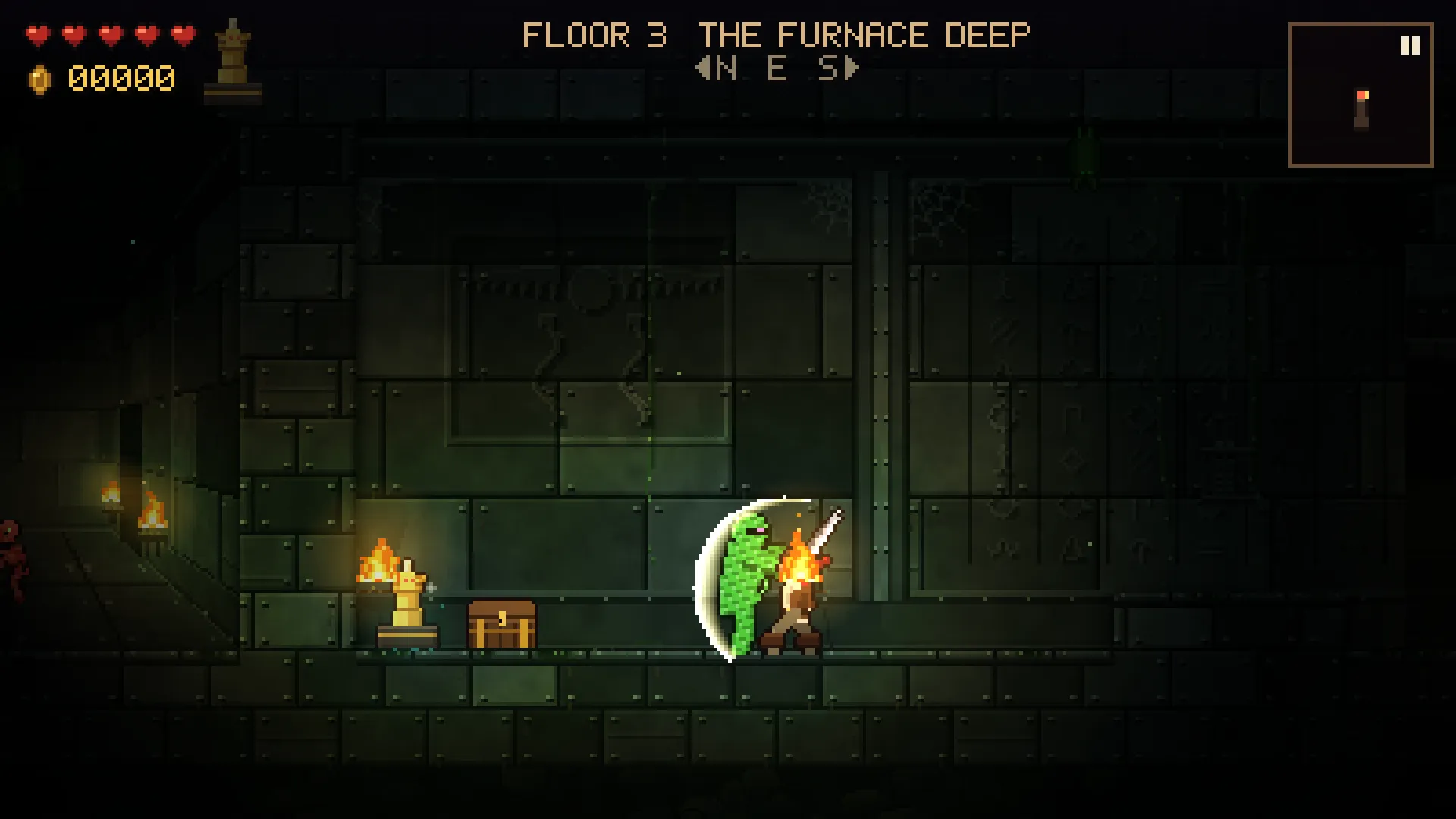 A sword swing cuts through a green ooze beside a treasure chest and the golden idol
